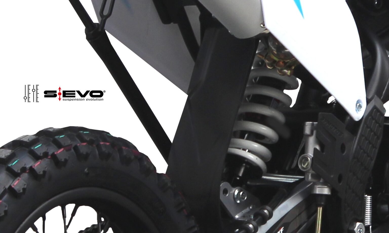 Detalhe do amortecedor traseiro hidráulico da pit bike MXF Pro Racing 125 RR azul, destacando o sistema de ajuste de altura na MXF Burt Motos em Campinas.